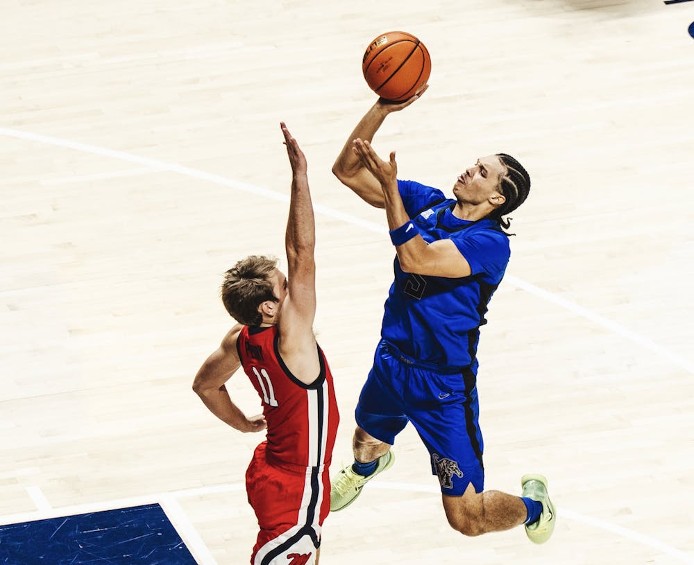 <p>Memphis guard Curtis Givens III shoots a floater in the Tigers&#x27; 83-77 loss at Ole Miss Tuesday night in Oxford. Givens III led Memphis with 20 points.</p>