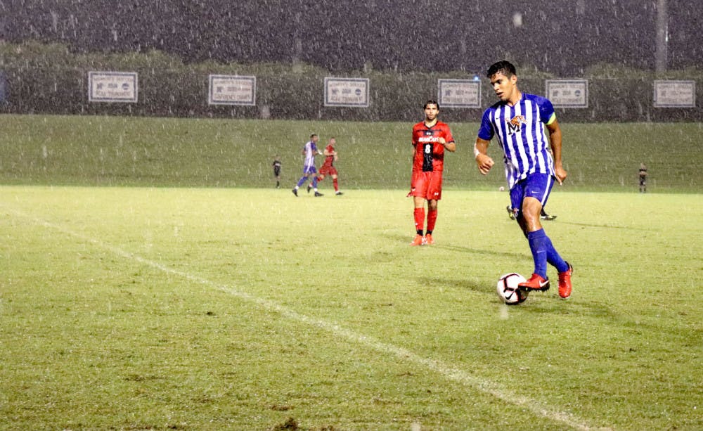 <p>David Zalzman dribbles the ball midfield against Cincinnati. The Tigers started conference play with a 1-0 win last Sunday.&nbsp;</p>