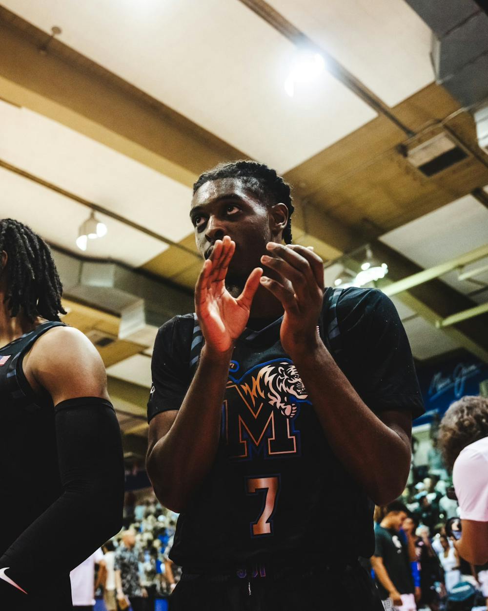 PJ Carter claps as Memphis defeats Michigan State in Maui.