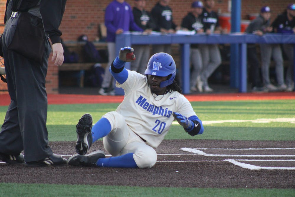 Memphis 2nd baseman Duante Stewart slides into home in the Tigers' 16-2 win over UNA.