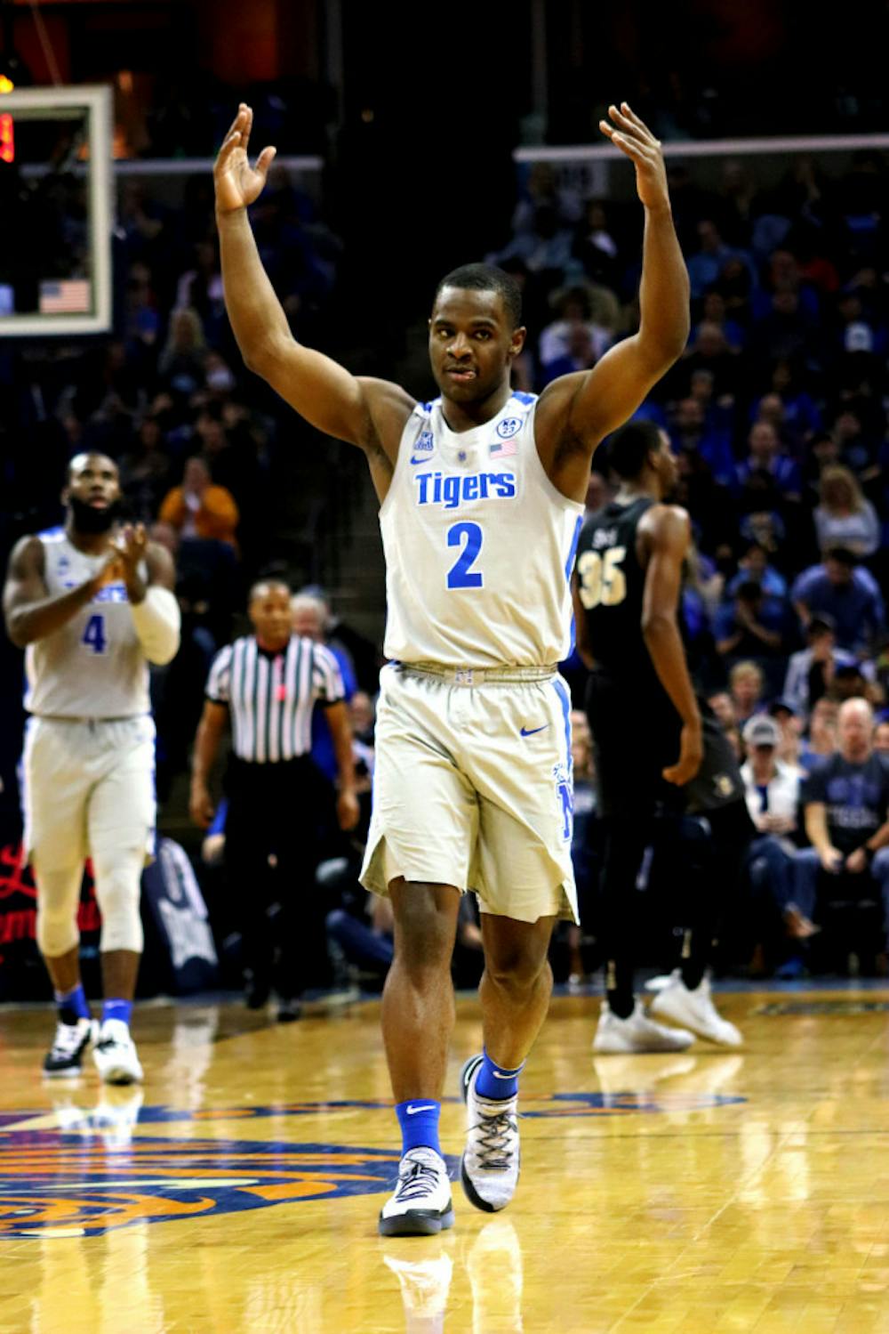 <p>Alex Lomax urging the crowd onto their feet as Memphis continued to build their lead in the second half vs UCF. Lomax ended the game with 8 points, 3 assists and 2 steals.&nbsp;</p>