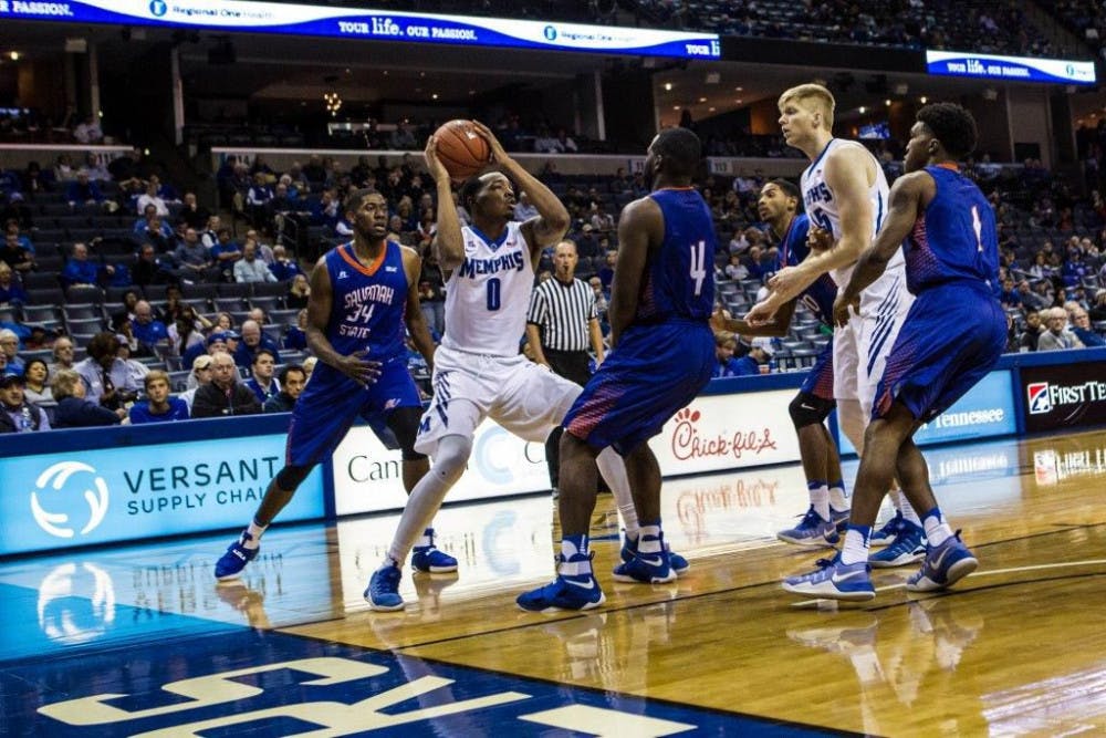 <p>K.J. Lawson (0) fights through defenders on Saturday in Memphis’ 99-86 win over Savannah St. K.J., the older of the two Lawson brothers, has posted double-doubles in two of the three games this season, giving the brothers five double-doubles in the team’s first three games.</p>