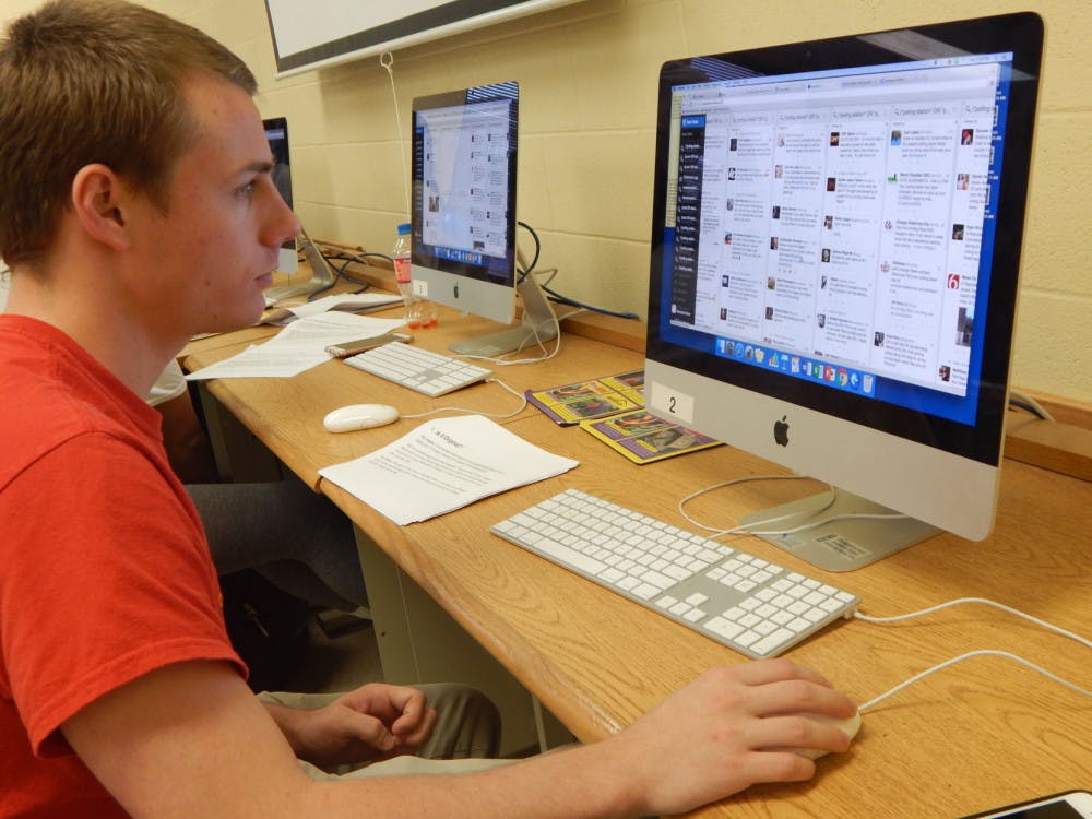 <p>Journalism senior, Jacob Woloshin, monitors TweetDeck to find tweets of users in Oklahoma who had problems at the voting polls for Election Land.</p>