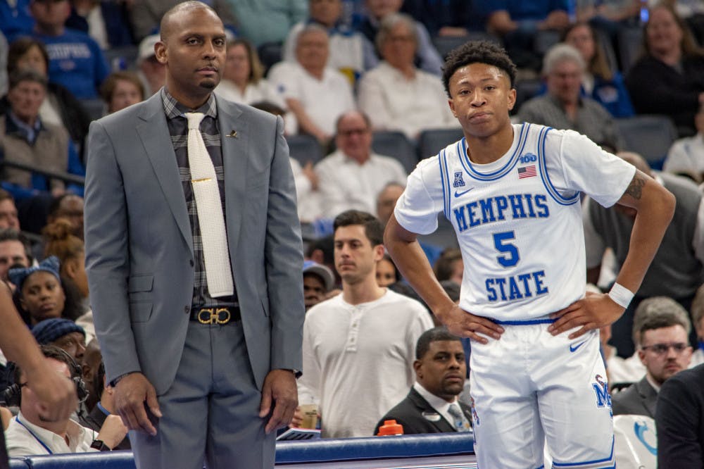 <p>Penny Hardaway and Boogie Ellis take a moment to look on during Wichita State free throws. The Memphis Tigers defeated the Shockers 68-60.&nbsp;</p>