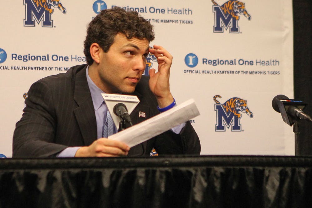 <p>University of Memphis coach Josh Pastner looks at the box score following the loss to UConn Feb. 4. The UConn loss is one of six Tigers’ losses in their last eight games.&nbsp;</p>