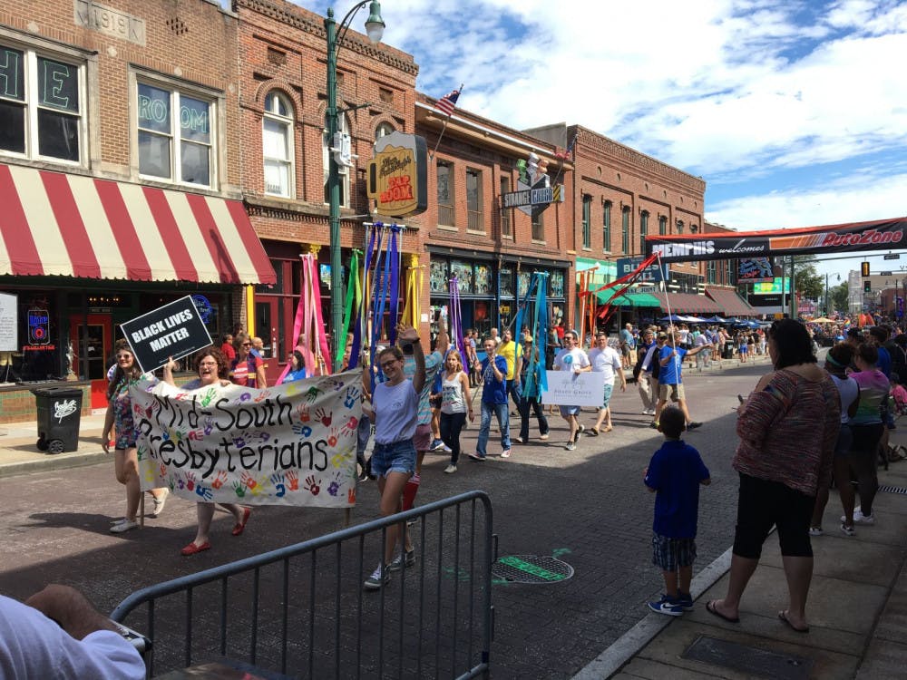 <p>Participants march in the Mid South Pride’s 14th annual festival Saturday. The event, which celebrated both LGBTQ and allies, was estimated to have attracted over 9,000 attendees to downtown Memphis.</p>