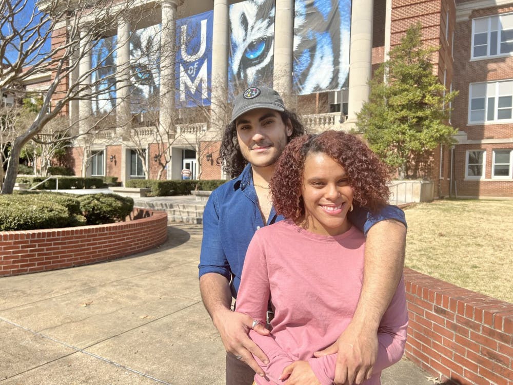 <p><span>Sweethearts Bria Cullison and Abraham Banat pose blissfully in front of the Administration Building on campus just days ahead of Valentine's Day.&nbsp;</span></p>