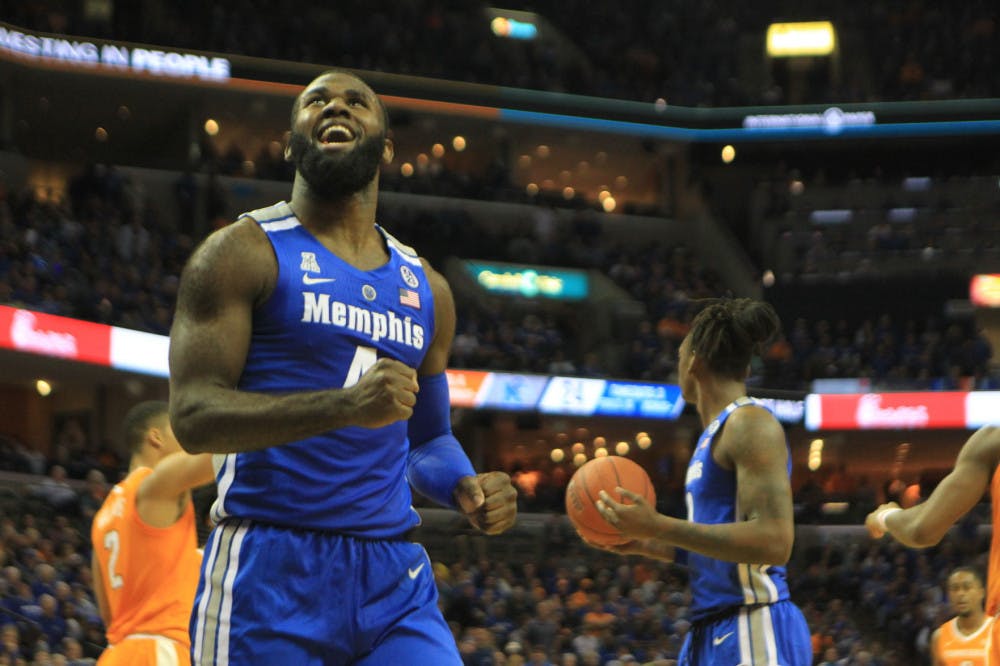 <p>Tigers' big man Raynere Thornton celebrates with the crowd during Saturday's game against Tennessee. Memphis dropped a tightly contested battle to the third ranked team in the nation 102-92.</p>