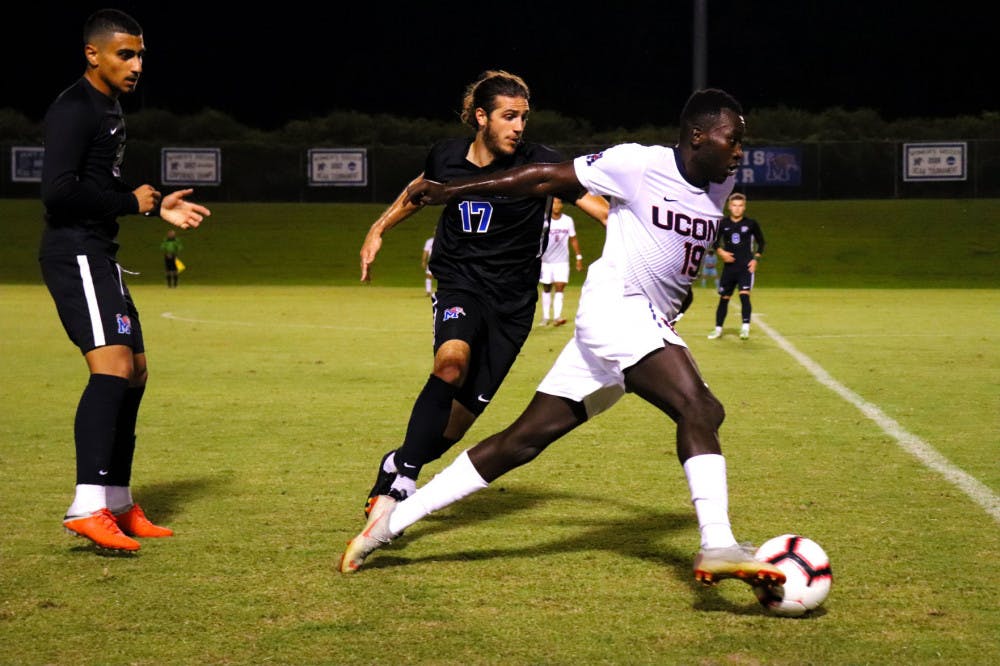 <p class="p1"><span class="s1">Mason Morise (17) tries to stop a UConn forward from making a run with the ball. This game was the Tigers’ first lost against UConn since 2014.<span class="Apple-converted-space">&nbsp;</span></span></p>