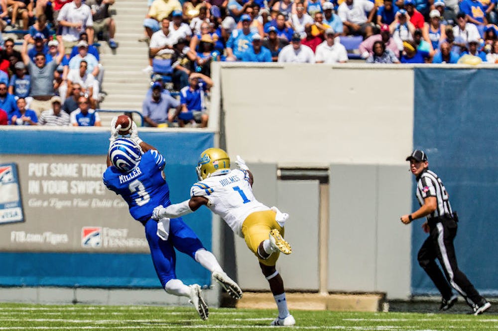 <p>Anthony Miller makes a diving grab for a big gain against UCLA. Miller is 95 yards from becoming the first player in program history with multiple 1,000-yard receiving seasons.</p>