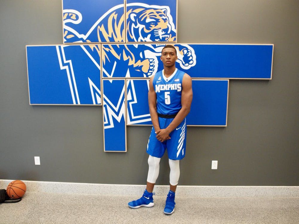 <p class="p1"><strong>Antwann Jones takes a photo near the Tigers logo. The four-star guard announced his commitment to Memphis after being granted a release from Texas A&amp;M.</strong></p>