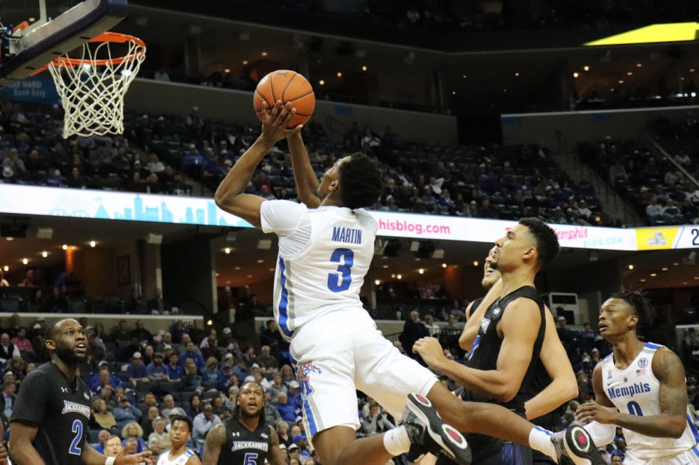 <p>Jeremiah Martin leaps past a South Dakota State defender for a shot. Martin tied for a team high in points, with Tyler Harris, with 22 points.&nbsp;</p>