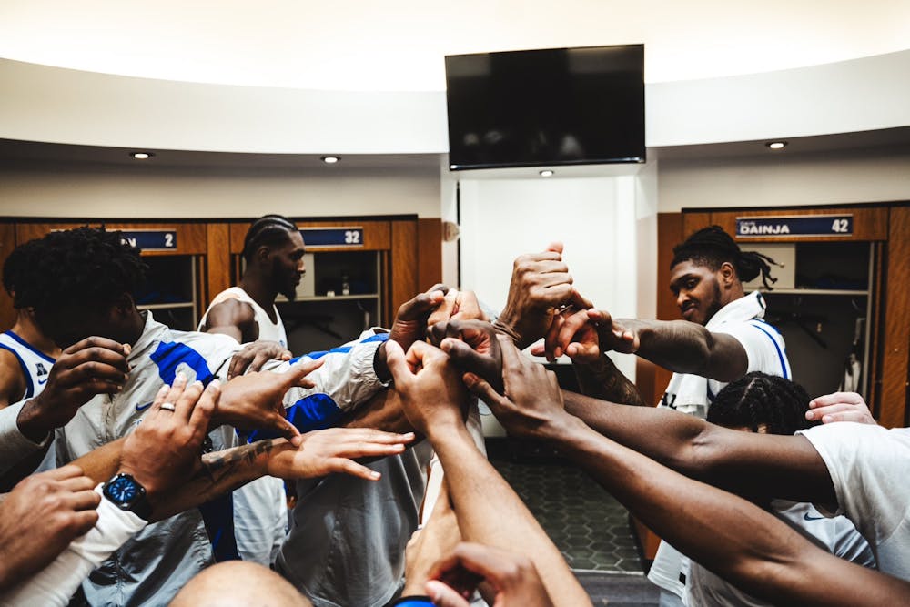 Moussa Cisse (back left) and Dain Dainja (back right) have different skillsets, but both are essential to Memphis' success.