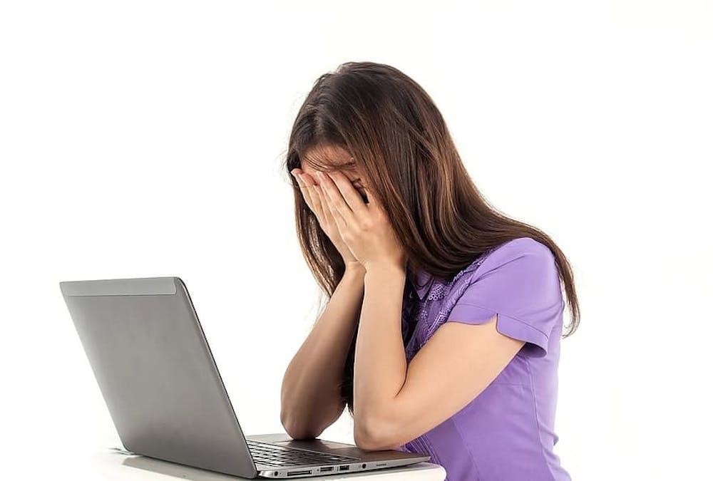 girl-computer-notebook-white-background-emotions-people-work-fatigue