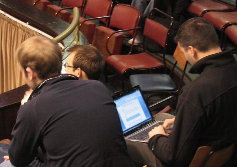 Busy and Elite Pre-Professional Student Uses Slack During Lecture