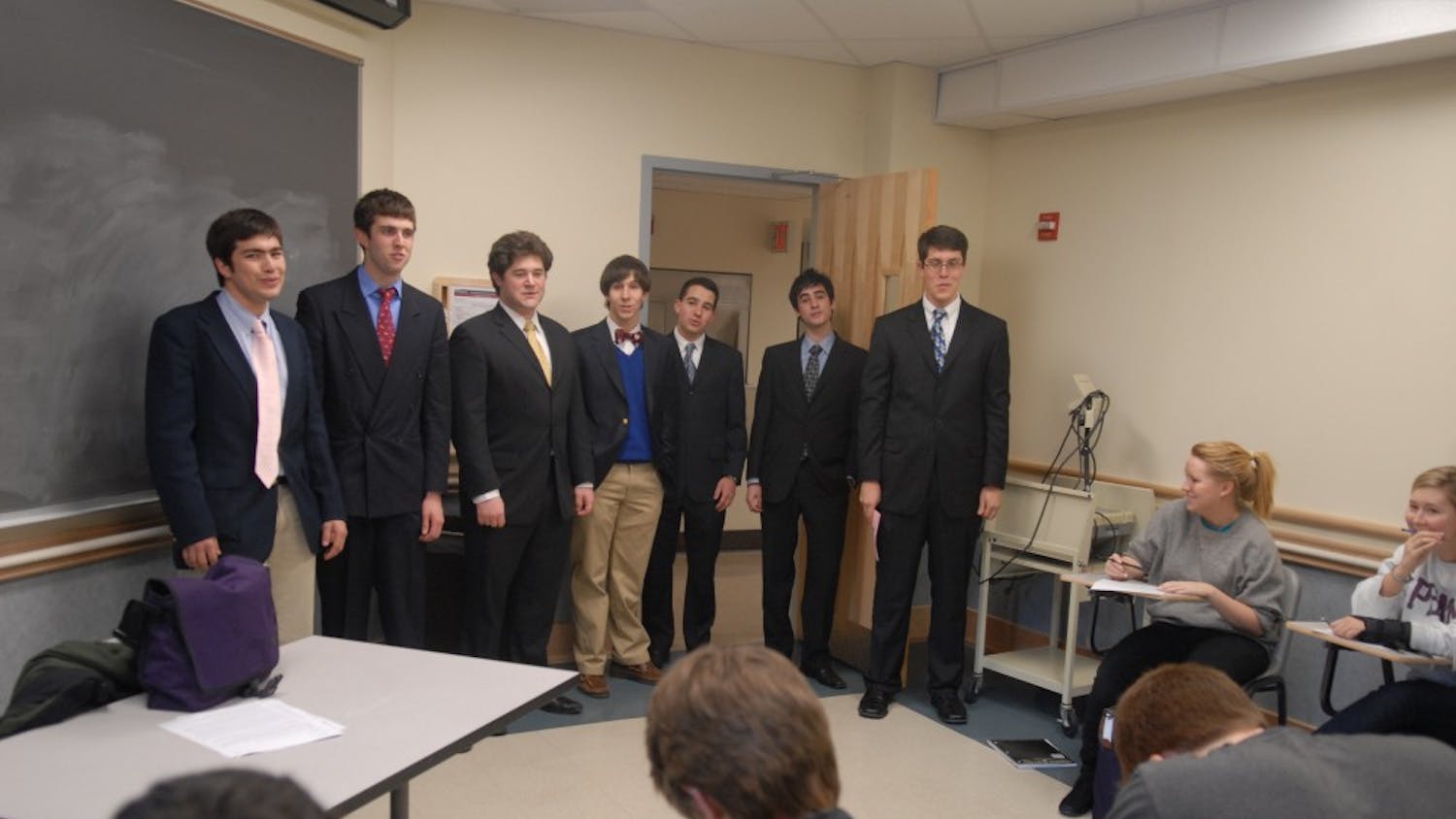 Penn Glee Club interrupts a class to deliver a singing valentine.