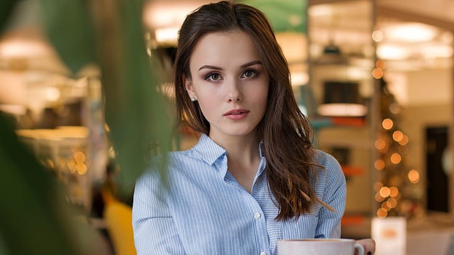 woman holding cup.jpg