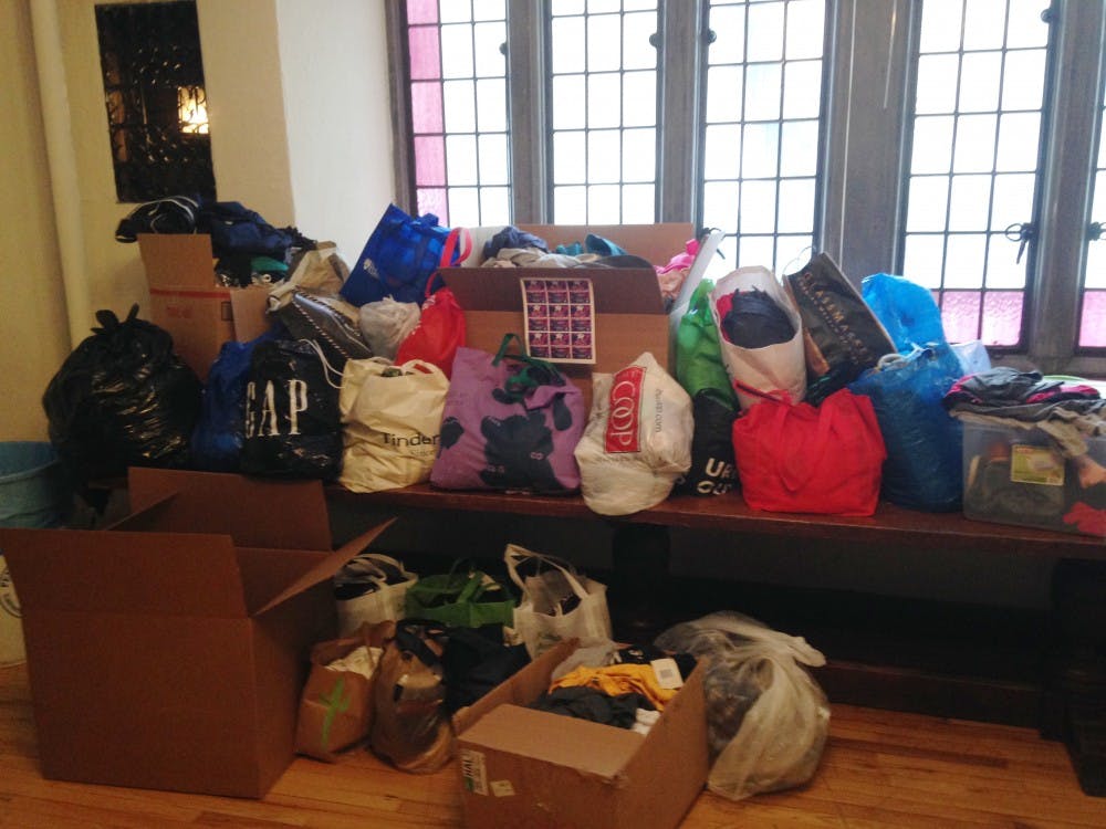 In collaboration with 12 other groups, Penn's Fiji fraternity collected 917 total articles of clothing during their clothes drive on Friday.