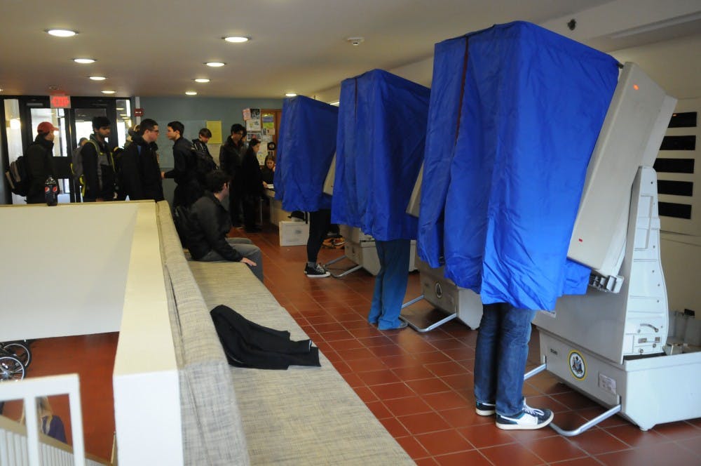 Photographs of students casting their votes in Houston Hall and Hill.