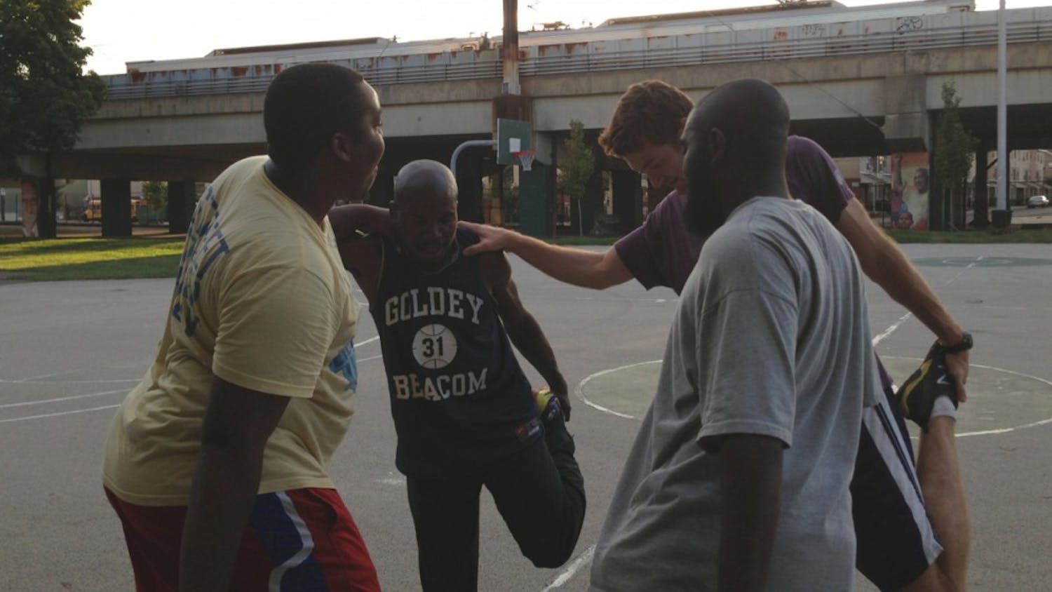 (From left to right) Reef Barclay, Walt Harris, coach John Salvucci and Ellish Danzy help each other at practice for Street Soccer Philadelphia, an organization committed to helping homeless youth and adults escape homelessness through team sport.