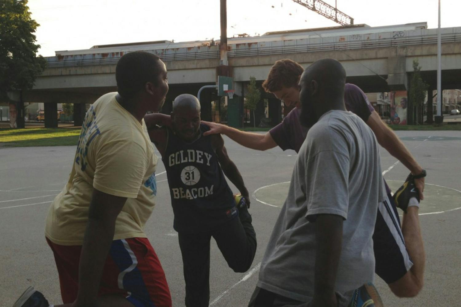 (From left to right) Reef Barclay, Walt Harris, coach John Salvucci and Ellish Danzy help each other at practice for Street Soccer Philadelphia, an organization committed to helping homeless youth and adults escape homelessness through team sport.