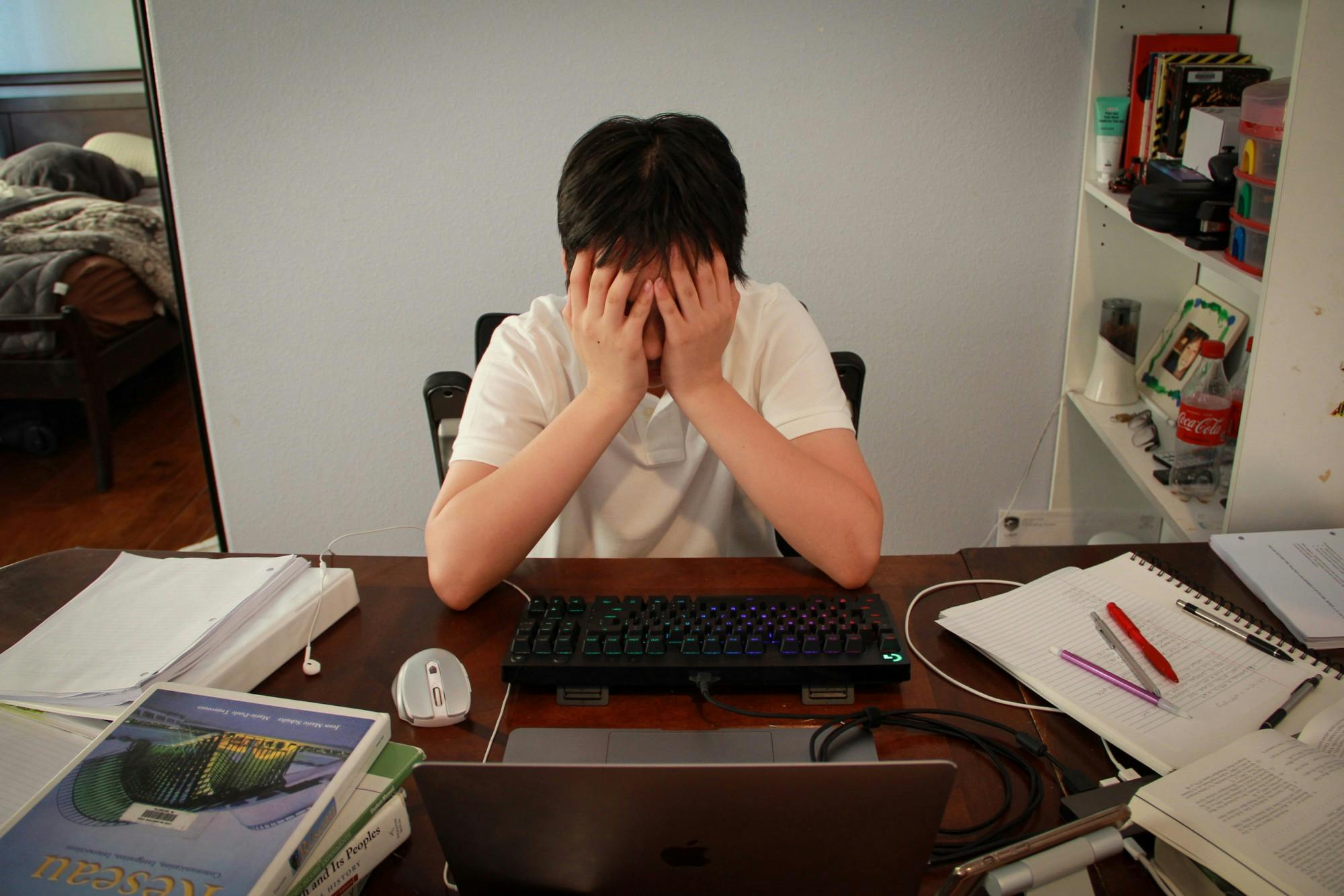 Stressed Overworked Student Studying Overwhelmed Textbooks Notebooks.JPG