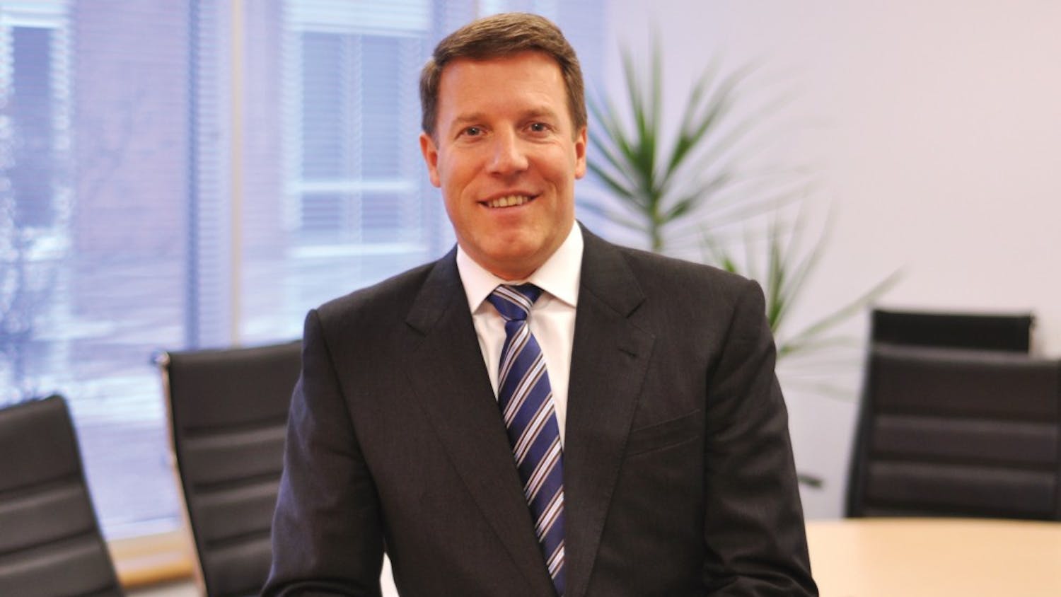 2002 Wharton graduate, Michael Parrish, poses here.