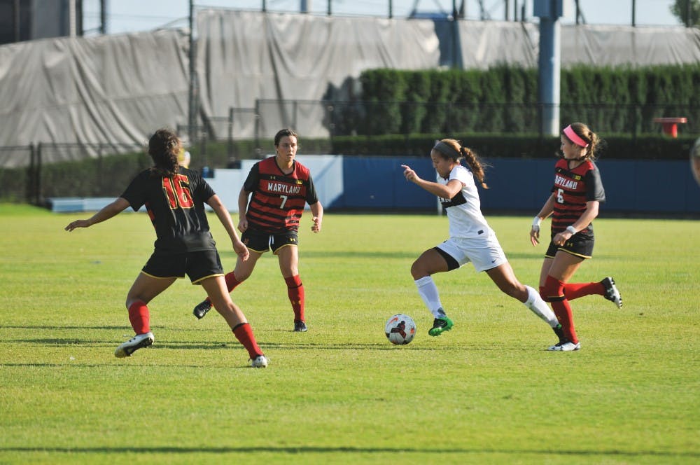 Freshman Emily Sands plays in her first game at Penn, dribbling through the Maryland opposition.