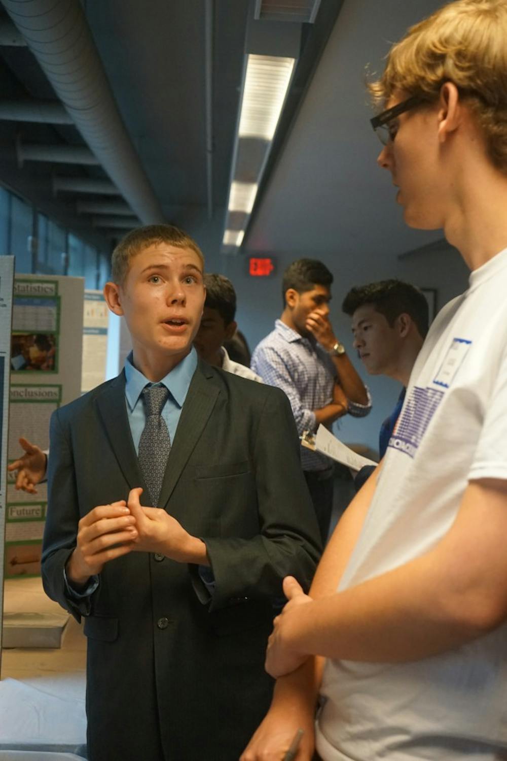 A high school student presented his science project to a Penn judge in the Levine Hall Lobby last Thursday as part of NanoDays.
