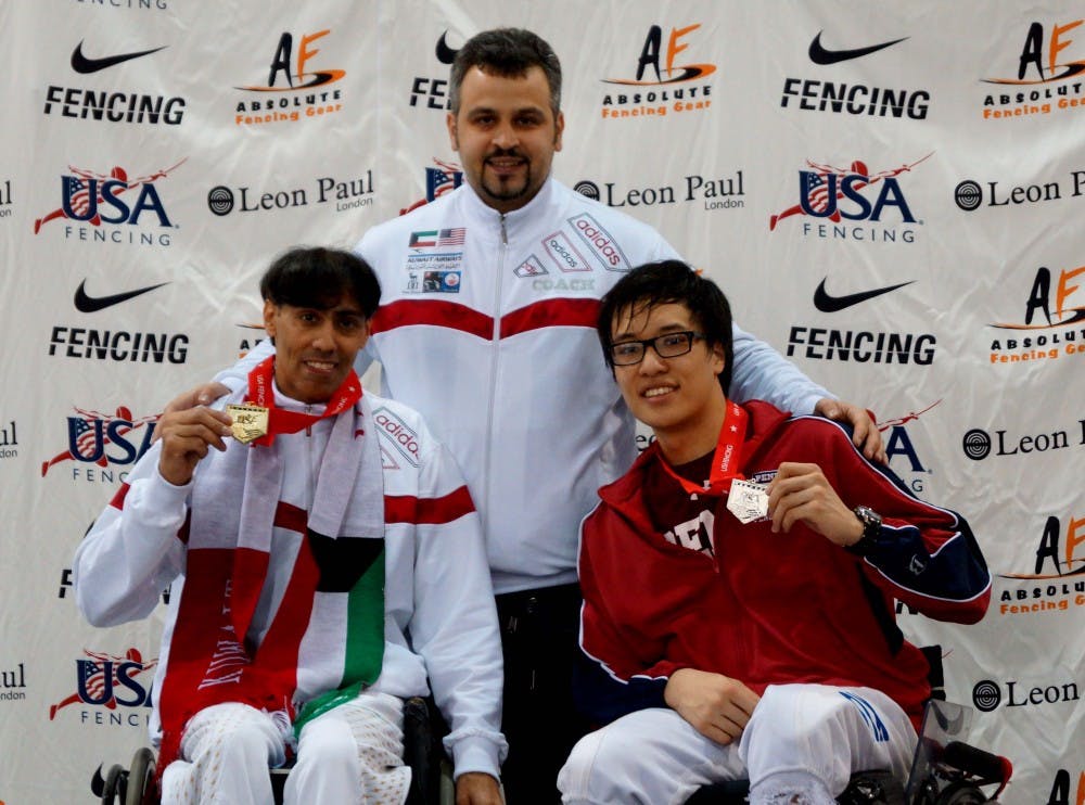 	*Freshman David Xu *(right) had his left foot amputated shortly after birth but has excelled in wheelchair fencing under the coaching of *Mickey Zeljkovic *(center). Xu is considering training for the 2016 Paralympics in Rio de Janeiro.