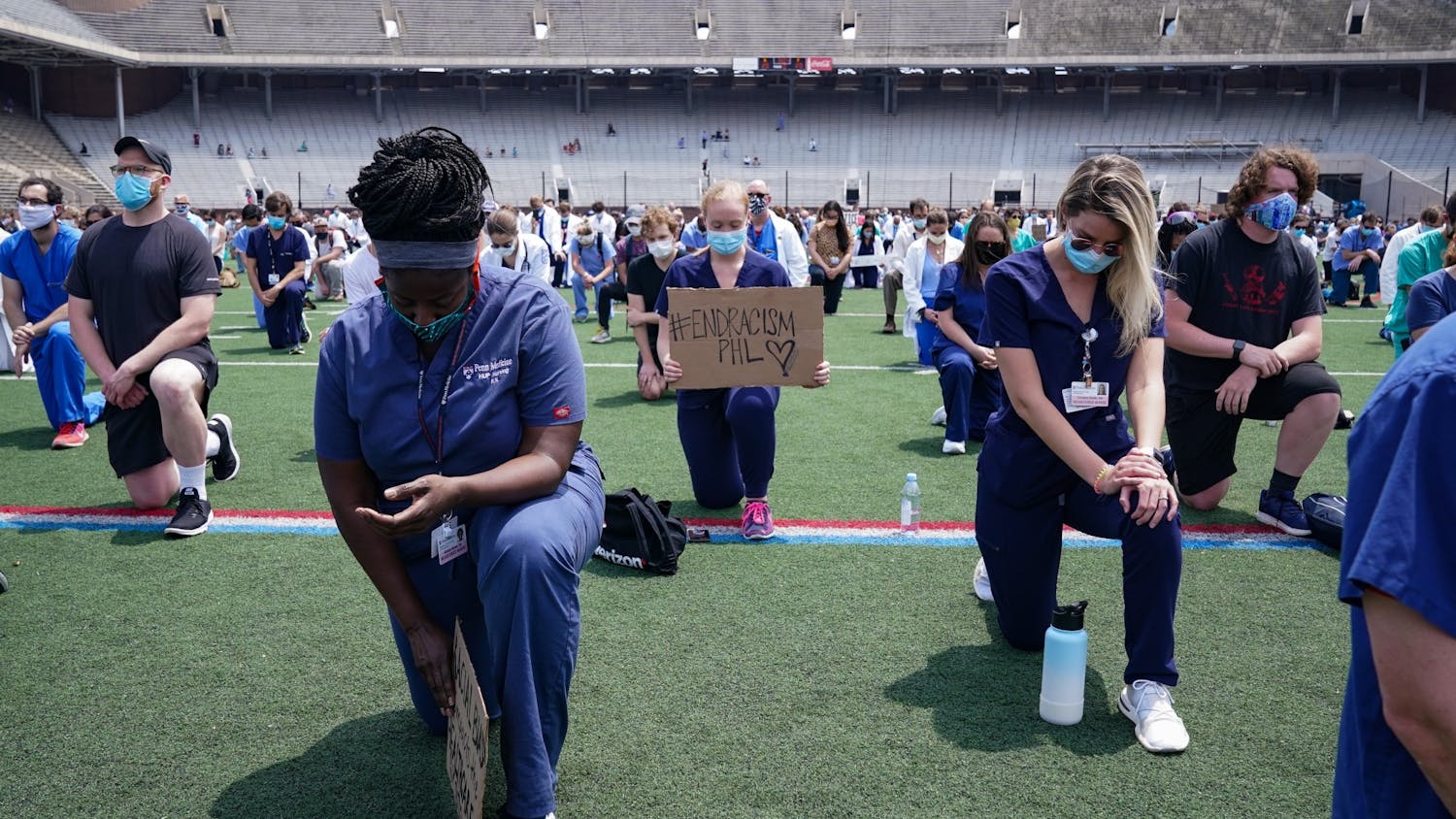 White Coats for Black Lives Kneeling End Racism Sign.jpg