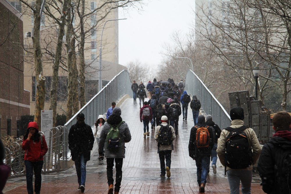 Students walking to class in the snow on Monday morning.