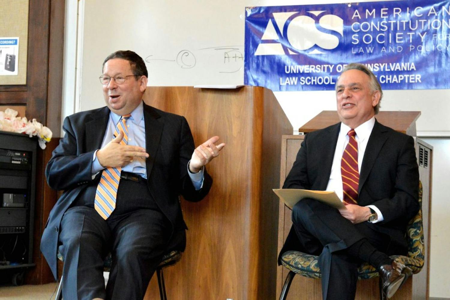 Executive Vice President of Comcast David L. Cohen, left, who is also the Chairman of Penn's Board of Trustees, spoke yesterday on campus.
