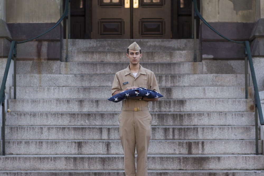College Sophomore Billy Morrison is often tasked with conducting 'Colors', wherein he marches from College Hall to the flag pole by Van Pelt and raises the American flag. He wakes up early three times a week for personal training through NROTC, and is slated to become an officer in the Navy when he graduates.