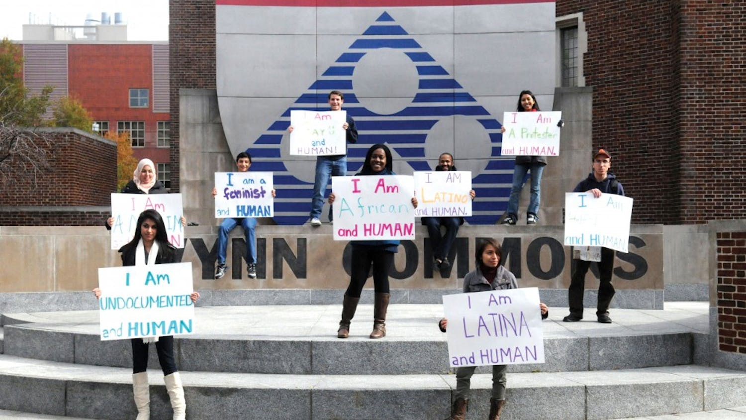 Penn for Immigrant Rights and Penn Political Coalition's I Am A Human Demonstration
Gionni Ponce '15 (hat)
Tania Chairez '14 (white boots)
Angel Contrera '13 (black jacket blue hood)
Abraham Moller '15 (A's hat)
Iris Mayoral '15 (I am Latina sign)
Afnaan Moharram '14 (tan headscarf)
Ibi Etomi '14 (turquoise)
Ricky Swieton '14 (Penn shirt)
Jose Gonzales '14 (grey sweatshirt)