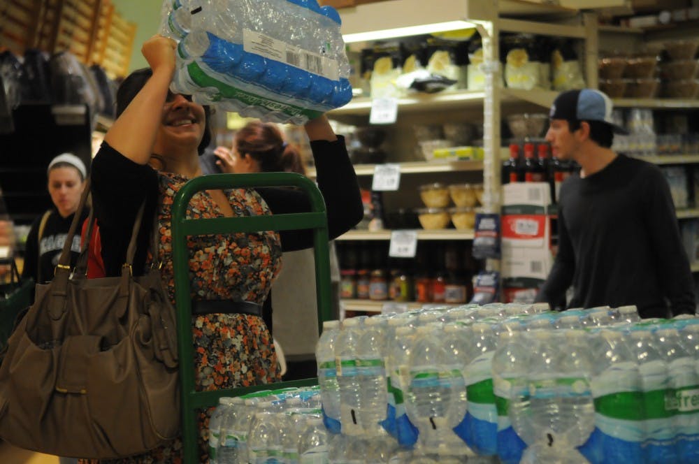Students pack Fresh grocer in preparation for Hurricane Sandy