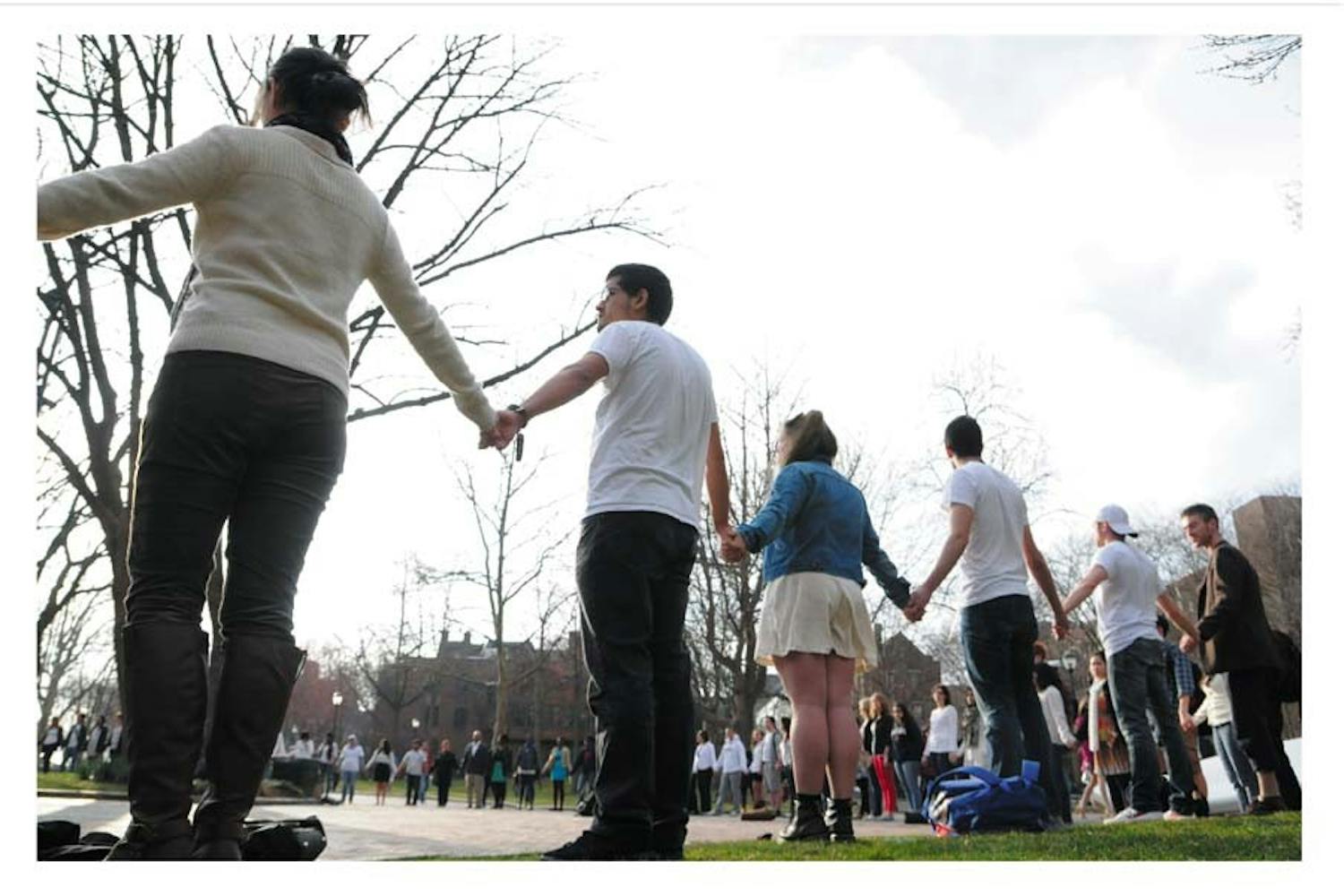 Students standing silently in support of Tania Chairez, an undocumented Wharton sophomore who was arrested