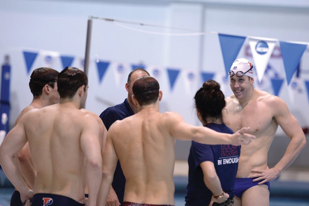 Brendan McHugh (right), a 2012 Penn grad, is now a graduate student and assistant swimming coach at the University. Will he be an Olympian, too?