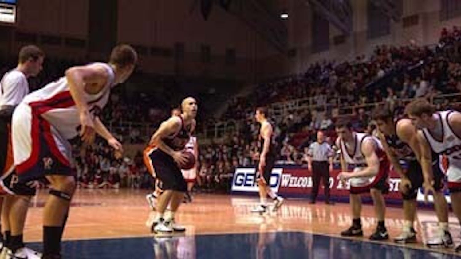 In tightly-called game, Quakers get past FT woes