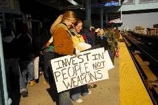 College sophomore Natalie Hamilton holds a sign during an antiwar march under the Philadelphia subway on Saturday. It was organized by the International Socialist Organization.