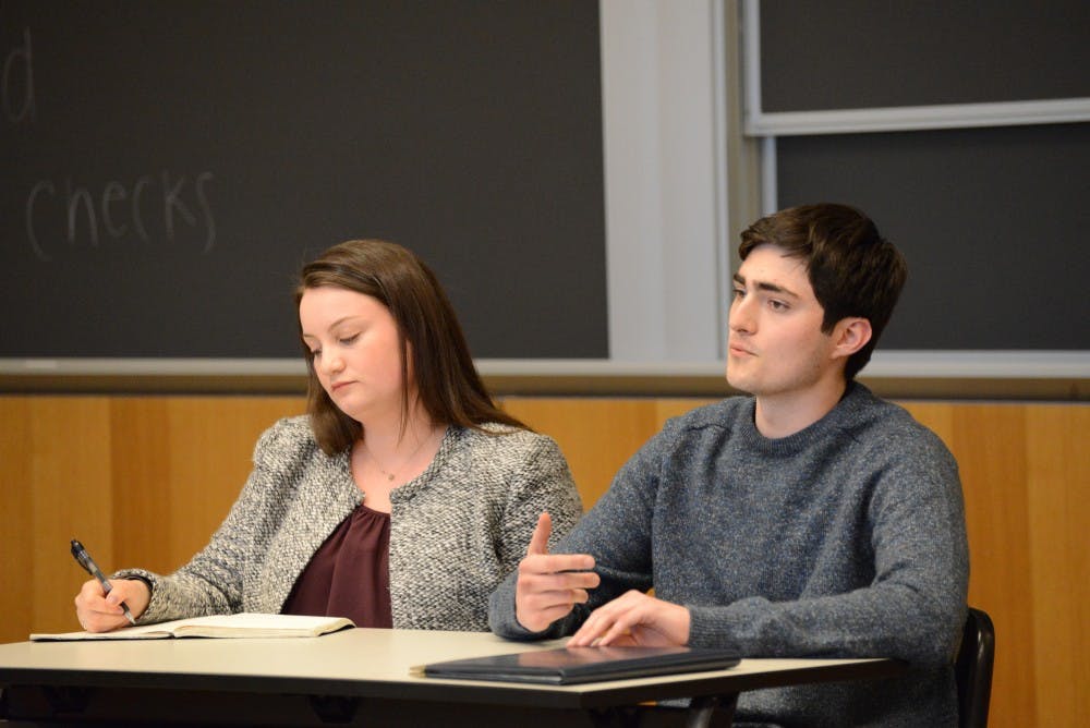 UA presidential candidates and College juniors Aidan McConnell (right) and Jane Meyer (left) participated in a series of three debates before Meyer won the election.