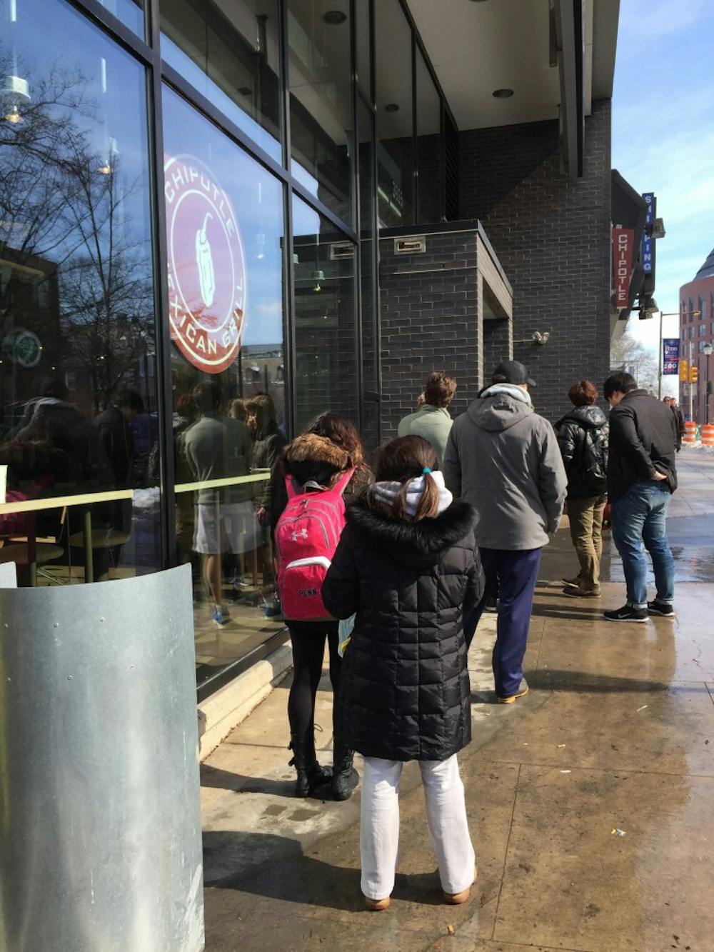 People lined up outside Chipotle shortly before 1 p.m., when it said it would open.