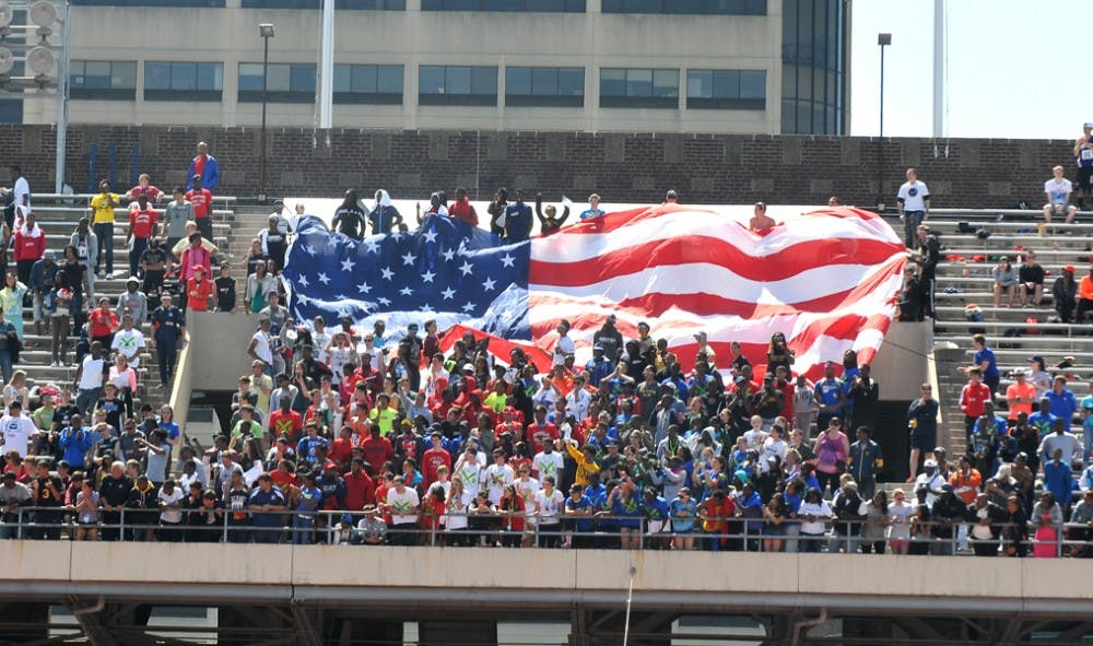 Penn Relays 2013, held at Franklin FIeld, featuring multiple Olympian athletes in the USA vs the World event
