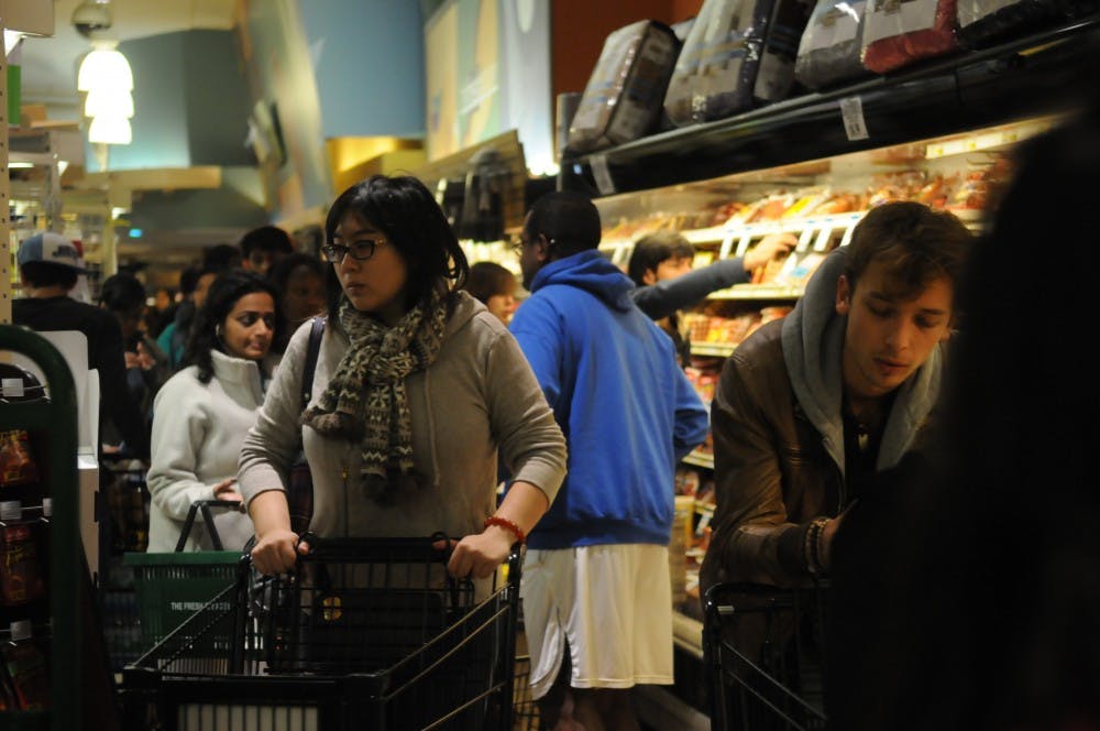 Students pack Fresh grocer in preparation for Hurricane Sandy