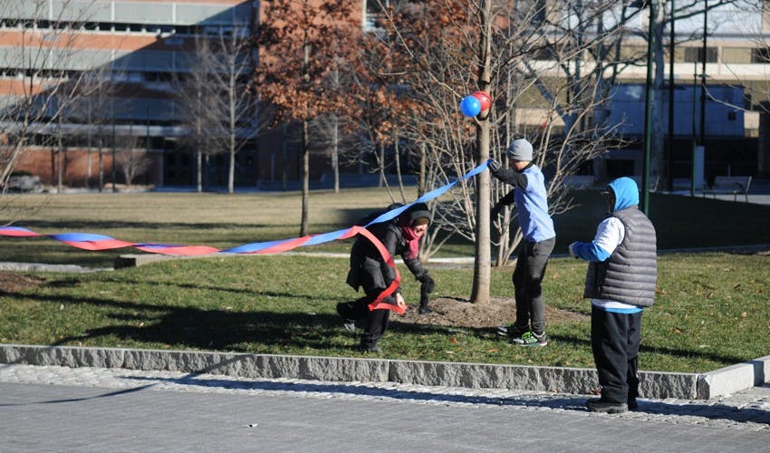Amy Guttmann speaking as part of a launch of a new sports program between West Philly elementary schools and Penn Athletics