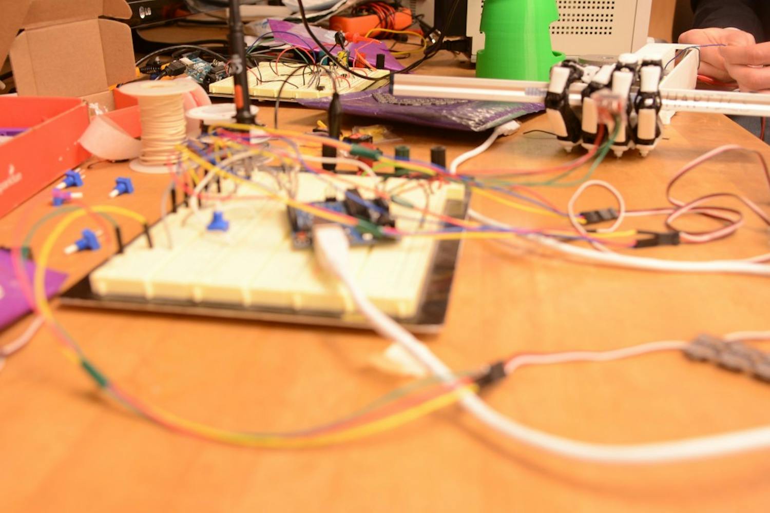 The circuit board detects pressure on sensor chips that are used to convey the sense of touch to a user.