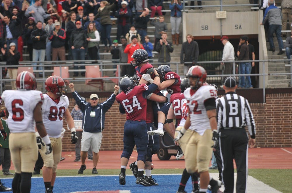 	Mitchell King and teammates celebrate Penn’s fourth-quarter touchdown Saturday.