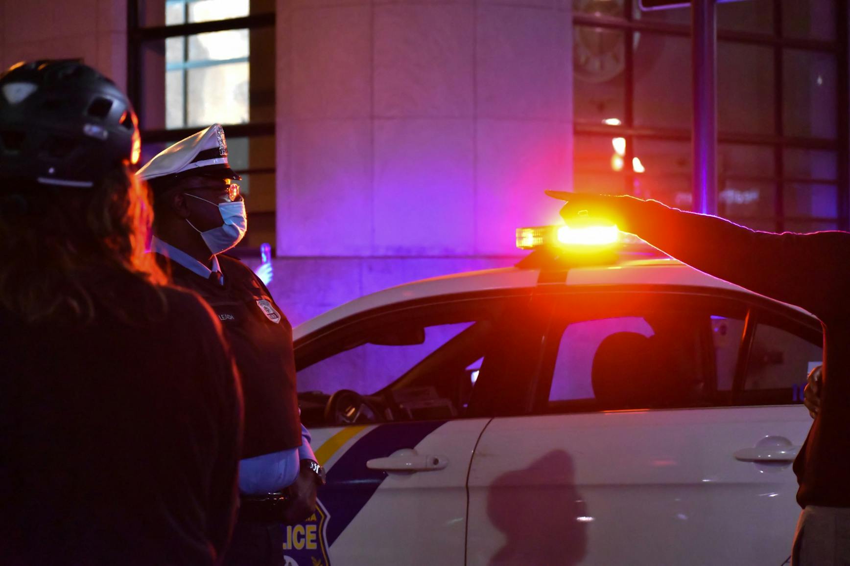 04-13-21 Justice for Daunte Wright Protest Pointing At Police Officer Masks Police Lights (Ana Glassman) .jpg