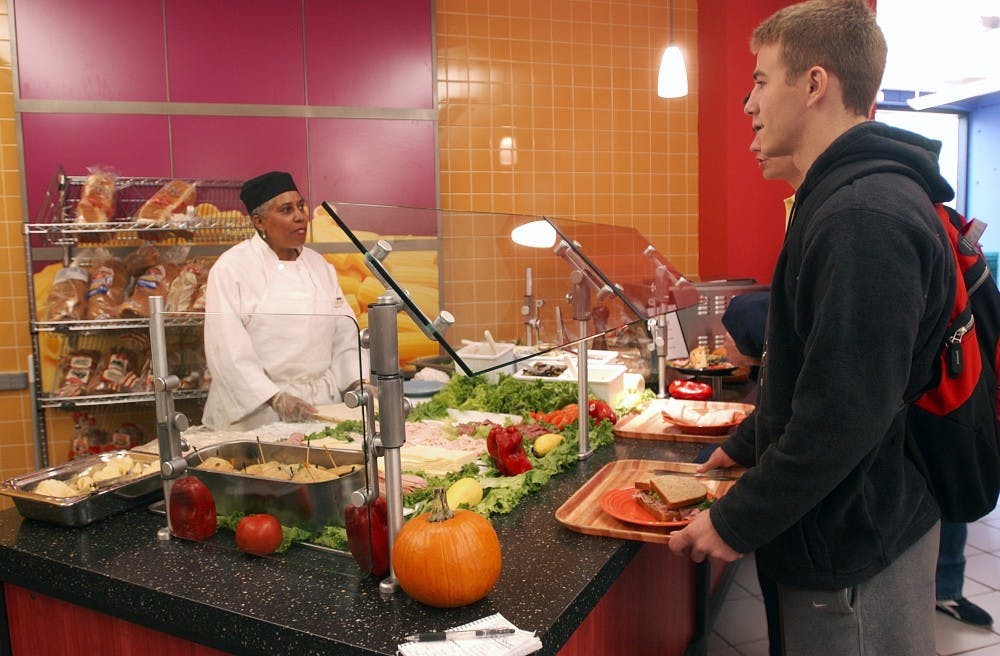 Matt McConville (College '07) waits for a sandwhich at the 1920 Commons