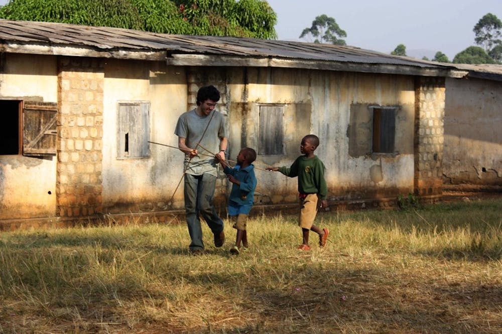 max_heinritz_carries_rebar_to_the_site_with_the_help_of_some_school_children.